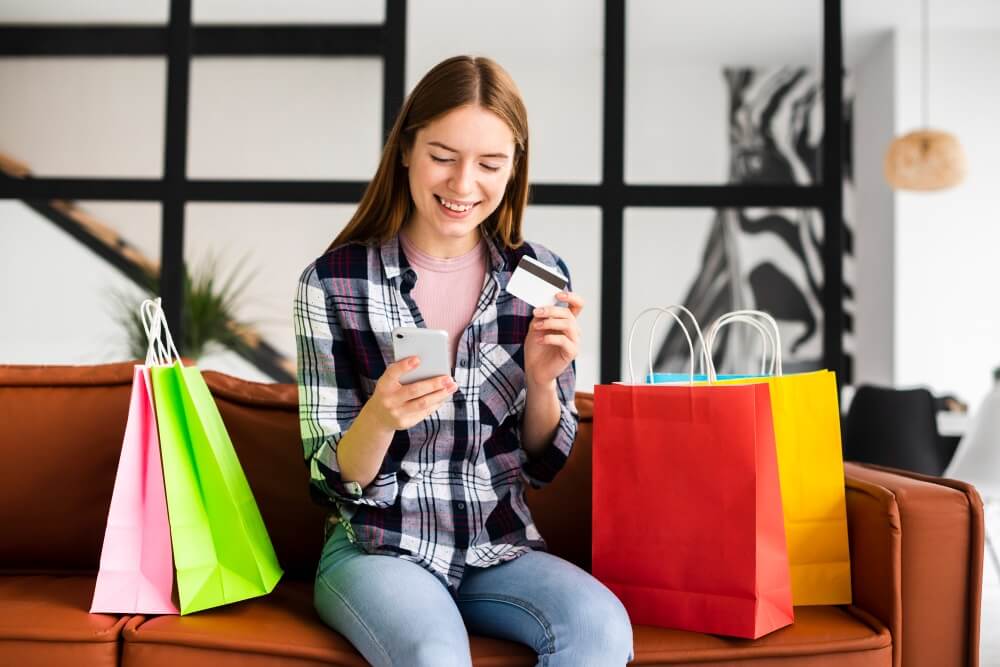 Young Girl online shopping in mobile